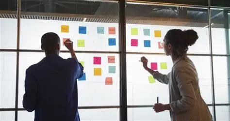 Team brainstorming with colorful notes — vision to MVP, turning clarity into motion.